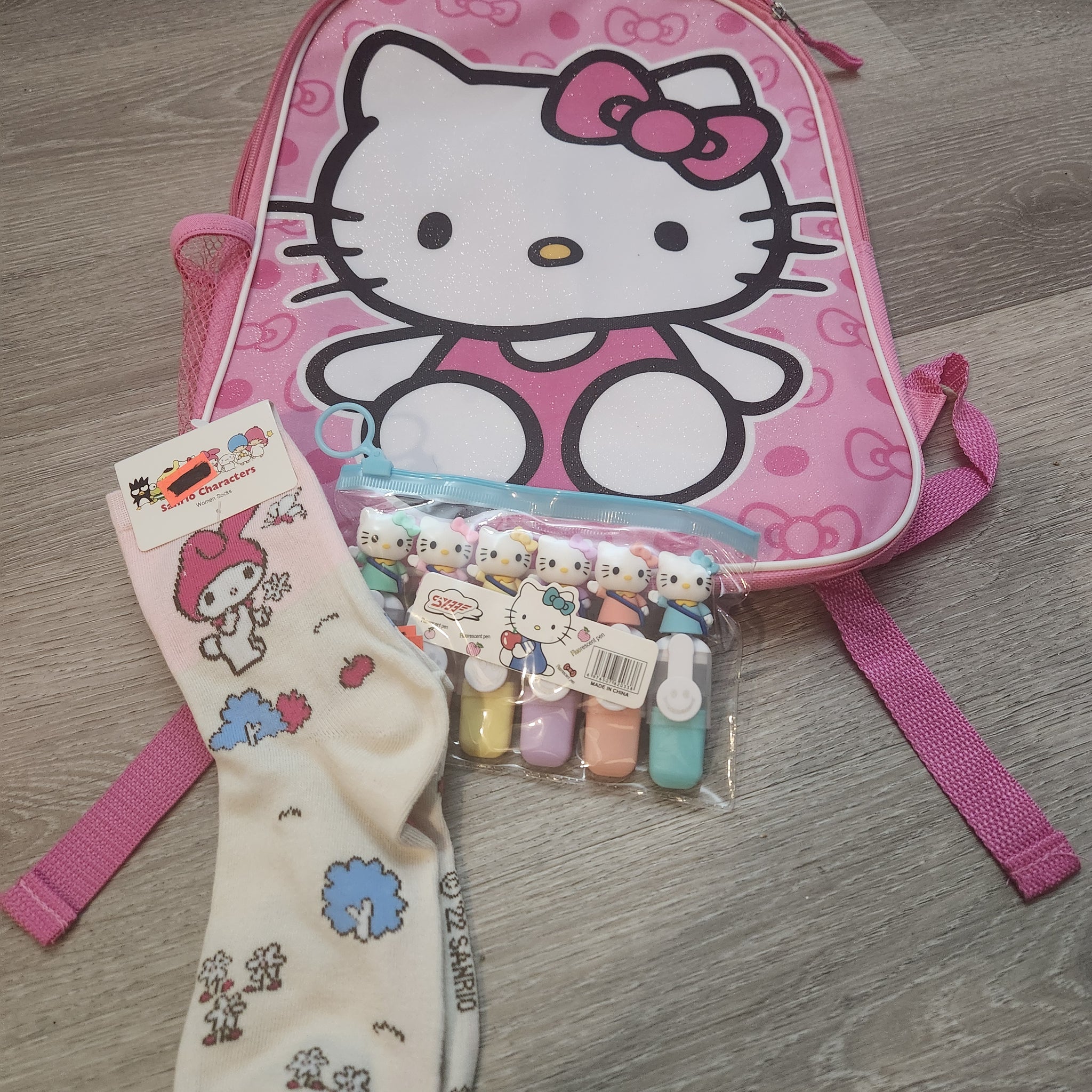 HELLO KITTY BACKPACK WITH HELLO KITTY SOCKS AND MARKERS!